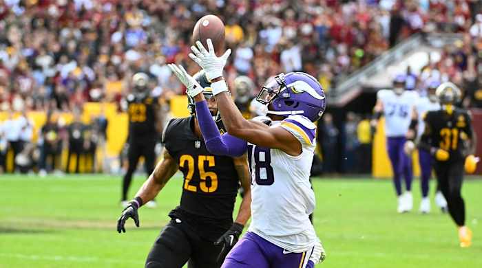 Nov 6, 2022; Landover, Maryland, USA; Minnesota Vikings wide receiver Justin Jefferson (18) makes a reception over Washington Commanders cornerback Benjamin St-Juste (25) during the second half at FedExField.